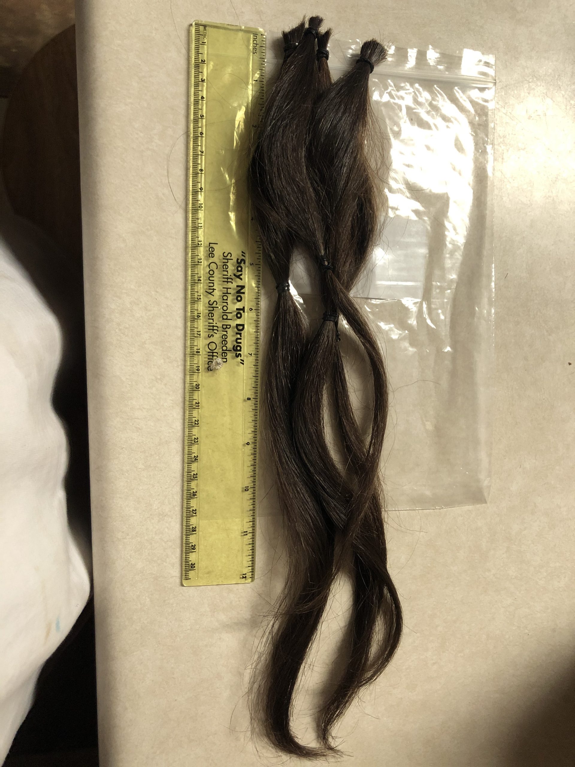 16 inches of brown male hair